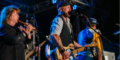 Live band performing on stage at Mendip Basecamp during Mendip Mini festival weekends